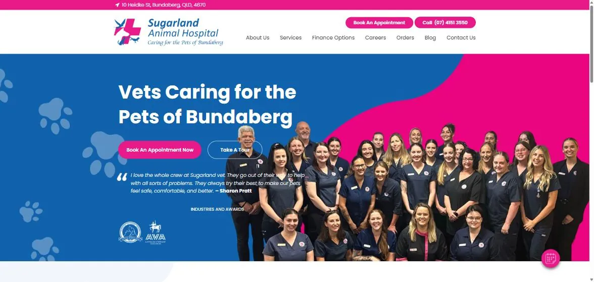 Sugarland Animal Hospital homepage with the headline "Vets caring for the pets of Bundaberg", a primary Book An Appointment Now button, a subdued Take A Tour button, a client testimonial and a team photo
